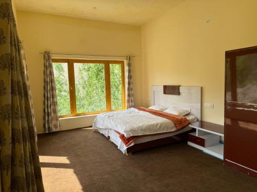 Postel nebo postele na pokoji v ubytování Om guest house