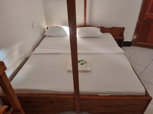 Ένα ή περισσότερα κρεβάτια σε δωμάτιο στο Shalom Homestay
