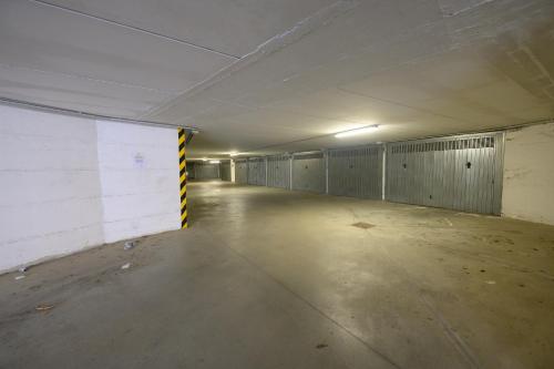 an empty parking garage with stalls in it at 320 - Casa Scorcio di Mare A due passi dal centro e dal mare di Riva Trigoso in Riva Trigoso