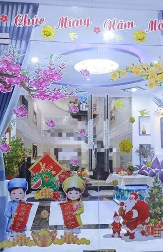 a room with a china minglinlinium mural at Hoàng Nga 2 Homestay in Phan Thiet