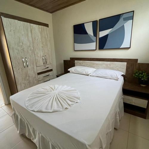 Ένα ή περισσότερα κρεβάτια σε δωμάτιο στο Apartamento Pé na areia