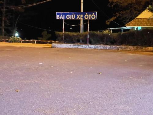 a street sign for a gas station at night at Hoàng Nga 2 Homestay in Phan Thiet