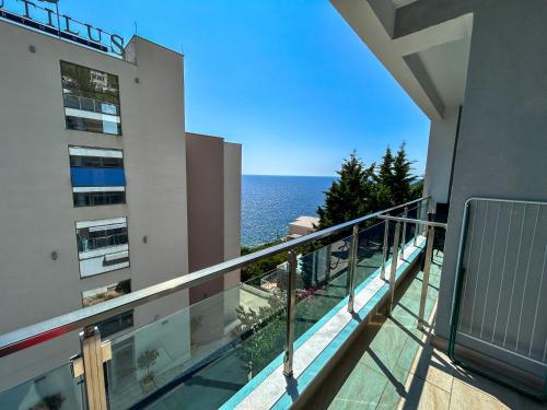 a balcony with a view of the ocean at Flabelline in Bar