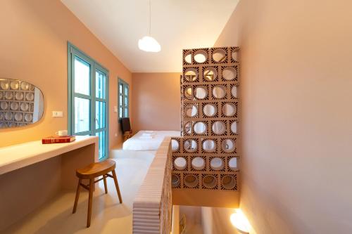 a room with a wall with plates on the wall at Via Vasileia in Kattavía