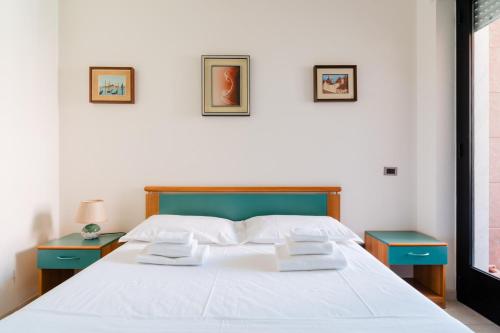 En eller flere senge i et værelse på Appartamentino Vicino al Mare