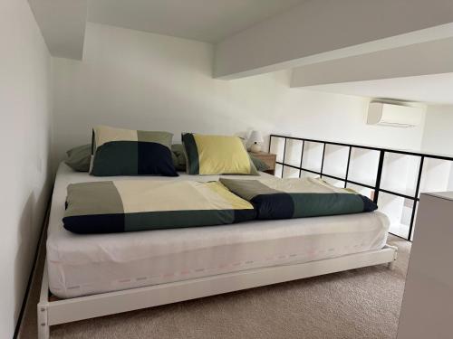 a bedroom with a large bed with a metal frame at Biztos Kuckó in Szeged