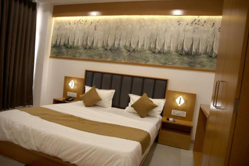 Hotel The Grand Shivaにあるベッド