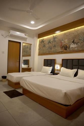 Hotel The Grand Shivaにあるベッド