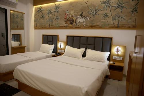 Hotel The Grand Shivaにあるベッド