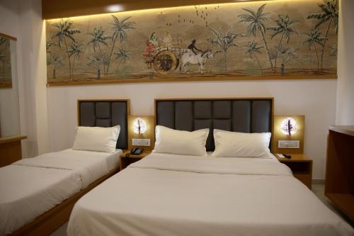 Hotel The Grand Shivaにあるベッド