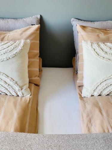 Una cama o camas en una habitación de Lindarhóll Guesthouse