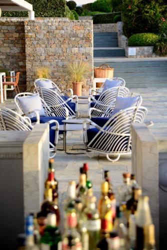 a group of chairs sitting in a patio at ANEMI Folegandros in Karavostasi