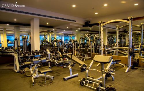 a gym with lots of treadmills and machines at I Hotel Batam in Nagoya