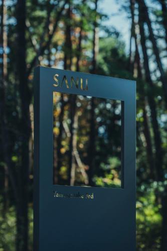 a blue box with the words samil in front of trees at SANU 2nd Home 八ヶ岳 3rd in Nagasawa