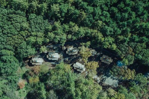 an aerial view of a home in the woods at SANU 2nd Home 八ヶ岳 3rd in Nagasawa