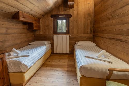 Ένα ή περισσότερα κρεβάτια σε δωμάτιο στο Hotel Chamois d'Or