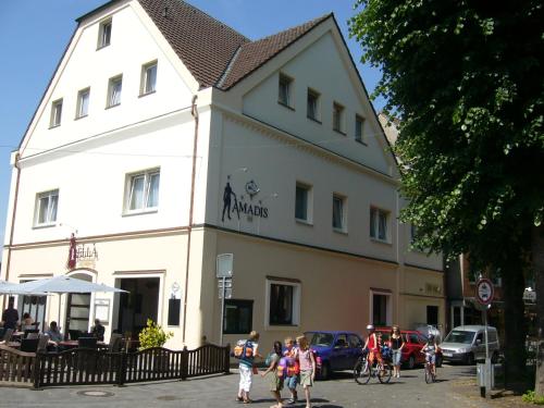 a group of people standing in front of a building at Hotel Amadis in Harsewinkel