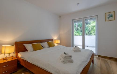 a bedroom with a bed with towels on it at Villa Gigi by Villas Guide in Poreč