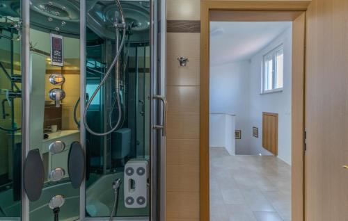 a bathroom with a shower and a glass door at Villa Gigi by Villas Guide in Poreč