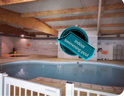 a swimming pool with a sign that reads melody swimming pool at Mobile-Home near to Europa Park, Rulantica in Boofzheim