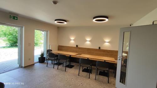 a conference room with a long table and chairs at Chmelnice na stezce in Napajedla