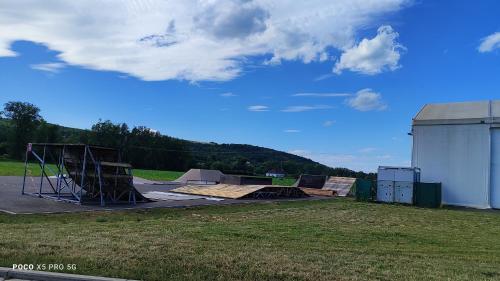 a group of skateboards on a ramp in a field at Chmelnice na stezce in Napajedla