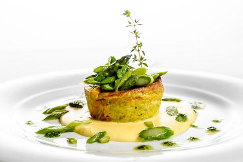 a plate with a piece of food on a white plate at Albergo La Rocca in Brisighella