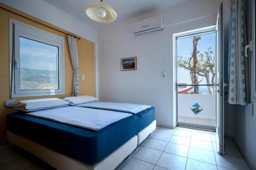 Ένα ή περισσότερα κρεβάτια σε δωμάτιο στο Mirtopolis