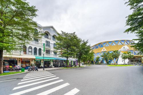 an empty street in a city with a bridge at Moc Lam Homestay GrandWorld Phu Quoc in Phu Quoc