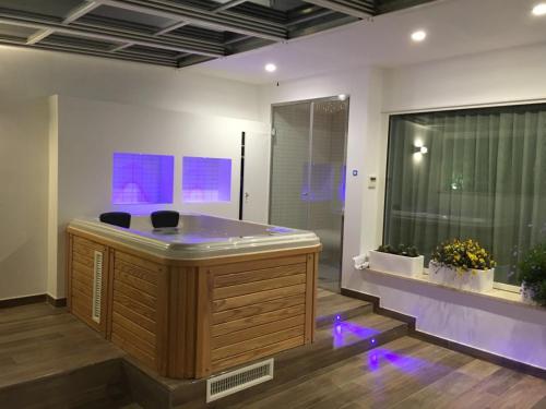 a jacuzzi tub with purple lights in a room at Principe Relais Suite & Spa in Gravina in Puglia