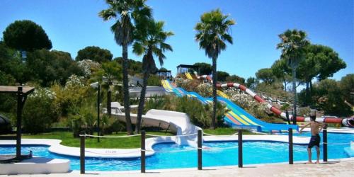 a water park with a water slide and a water slide at atico en Las Americas Islantilla primera línea de playa in Islantilla