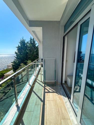 a balcony of a building with a view of the ocean at Flabelline in Bar
