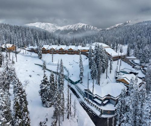 an aerial view of a resort in the snow at The Khyber Himalayan Resort & Spa in Gulmarg