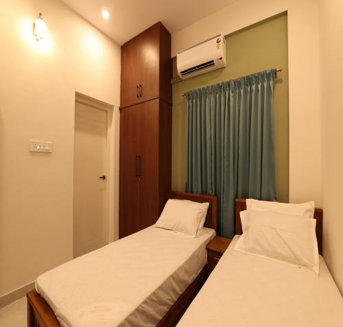 Katil atau katil-katil dalam bilik di Olivette Suites