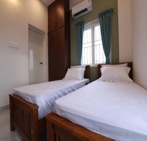 Katil atau katil-katil dalam bilik di Olivette Suites