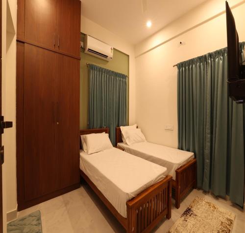 Katil atau katil-katil dalam bilik di Olivette Suites