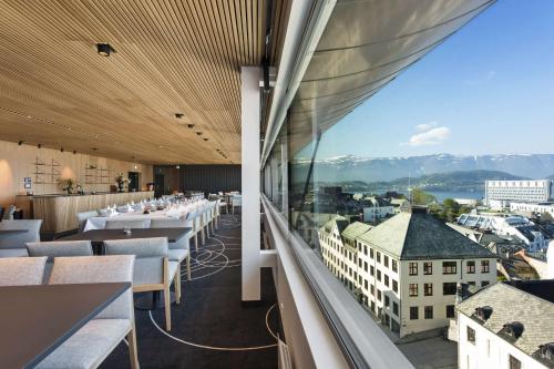 a restaurant with a view of a city at Scandic Parken in Ålesund