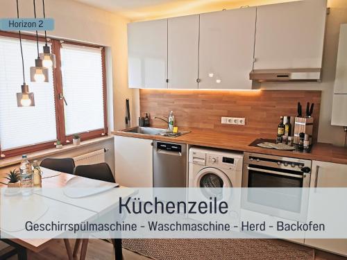 Η κουζίνα ή μικρή κουζίνα στο Newman Horizon Apartments Zirndorf - Playmobil Funpark, Nähe Messe Nürnberg und Fürth, 4 Pers, 24h Self Checkin, Waschmaschine, großer Parkplatz