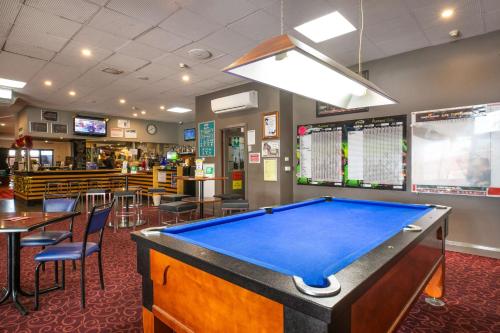 a pool table in a restaurant with a bar at Nightcap at Hendon Hotel in Adelaide