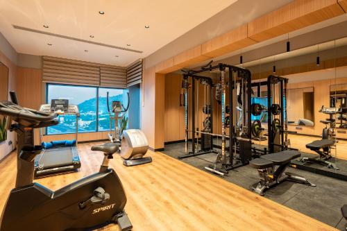 a gym with treadmills and cardio equipment in a room at Park Inn by Radisson Vellore in Vellore
