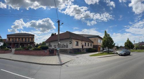 a street with a building on the side of the road at Retro domeček Dolany u kruháče in Dolany