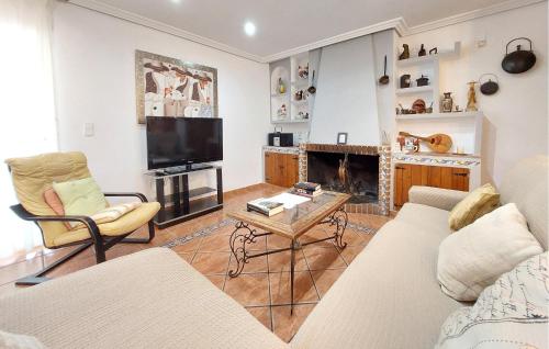 a living room with a couch a table and a tv at Awesome Home In Bétera in Bétera