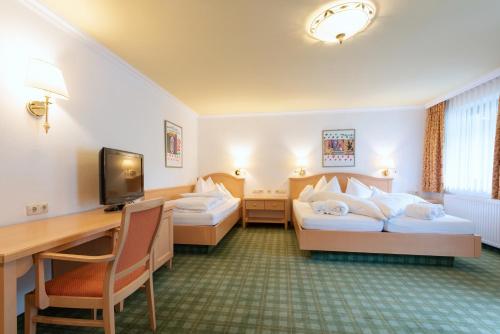 Ένα ή περισσότερα κρεβάτια σε δωμάτιο στο Heart Hotel Arlberg