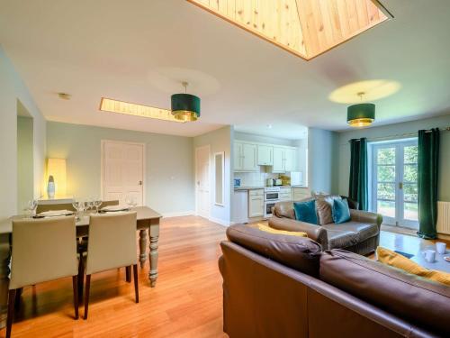 a living room with a couch and a table at 2 Bed in Sanquhar 89403 in Sanquhar