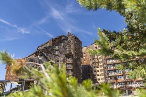 a tall building with trees in front of it at Résidence Saskia Falaise - Avoriaz in Avoriaz