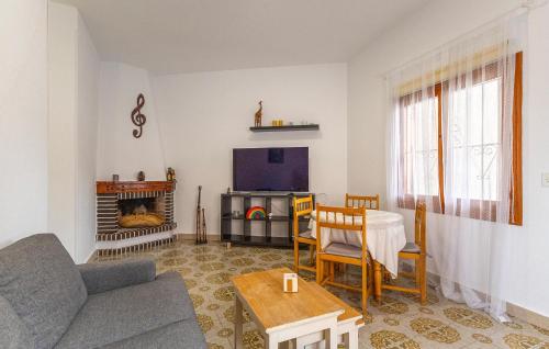 a living room with a couch and a tv at Awesome Home In Torrevieja With Wifi in Torrevieja