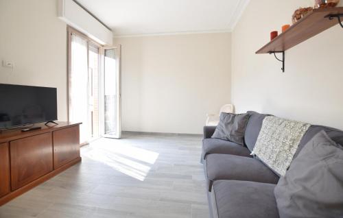 a living room with a couch and a flat screen tv at Beautiful Apartment In Piano Di Mommio in Piano di Mommio