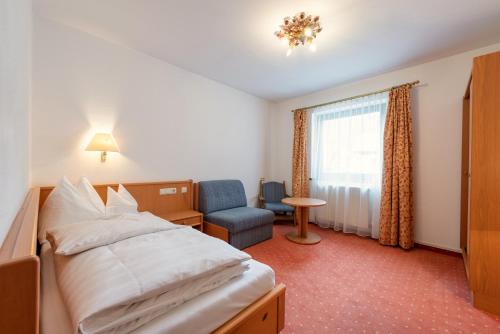 Ένα ή περισσότερα κρεβάτια σε δωμάτιο στο Heart Hotel Arlberg