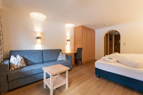 Ένα ή περισσότερα κρεβάτια σε δωμάτιο στο Heart Hotel Arlberg