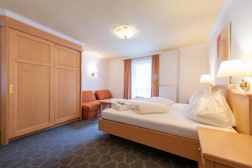 Ένα ή περισσότερα κρεβάτια σε δωμάτιο στο Heart Hotel Arlberg